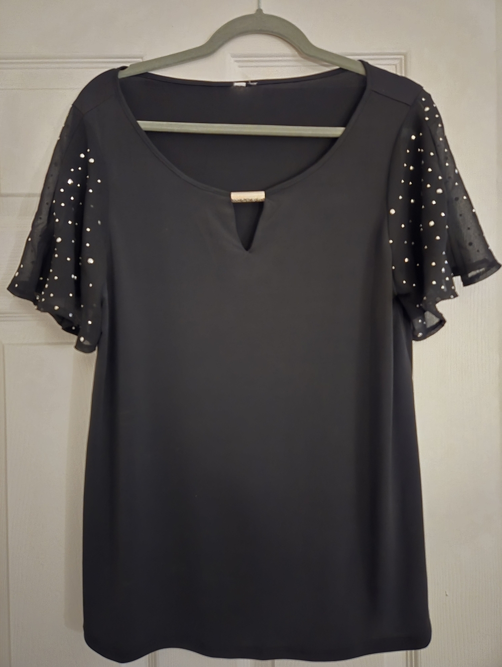Elegant Black Top with Embellished Sleeves